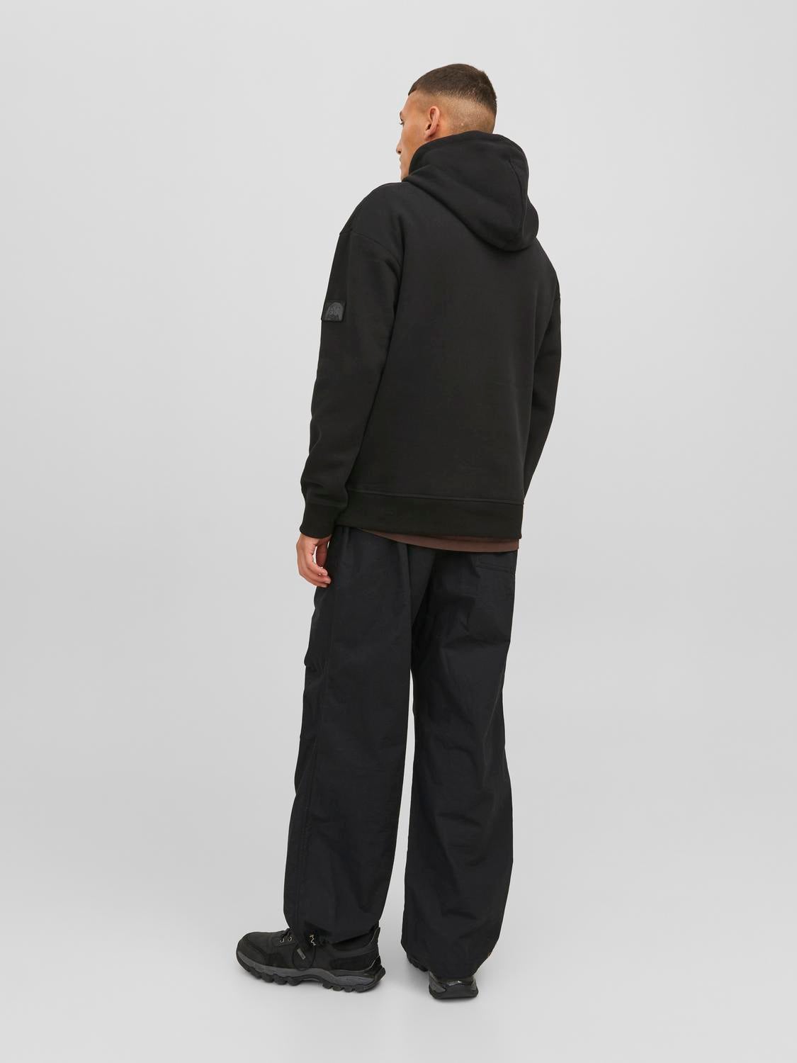 Premium Photo  Girl in black cargo pants and black hoodie